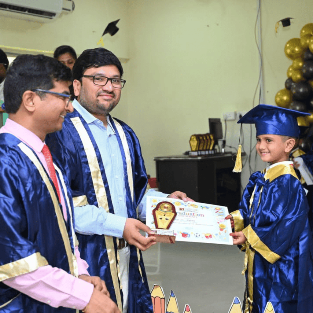 Children receiving certificates at a school graduation day